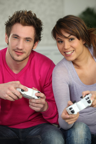 A couple playing video games - 写真・画像