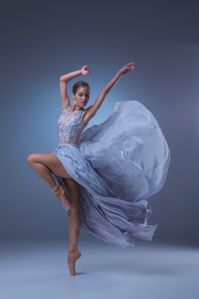 The beautiful ballerina dancing in blue long dress - Foto, immagini