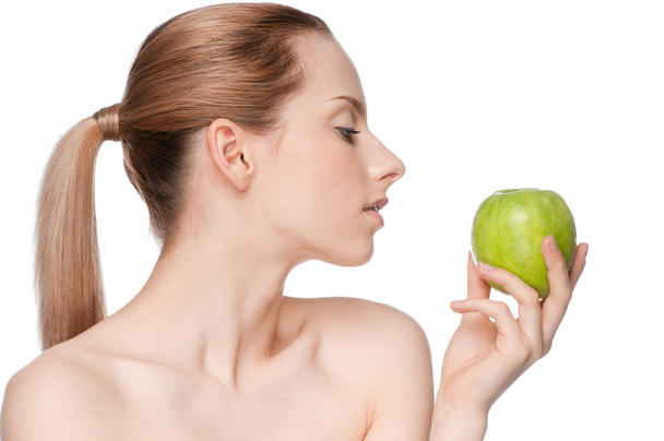 Woman eat green apple - Foto, imagen