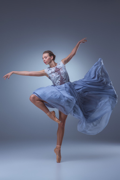 The beautiful ballerina dancing in blue long dress - Photo, image