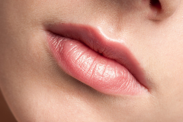 Close-up lips of beauty young woman - Fotó, kép