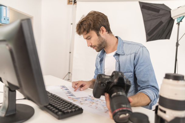 photographer working in office - Photo, Image