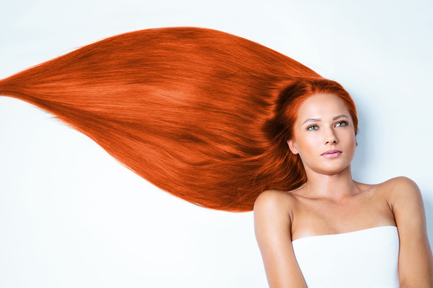 Woman with long red hair - Фото, зображення