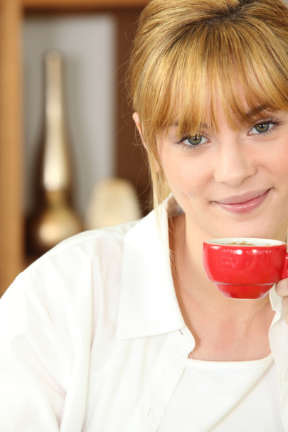 Young woman drinking a cup of expresso coffee - Photo, image