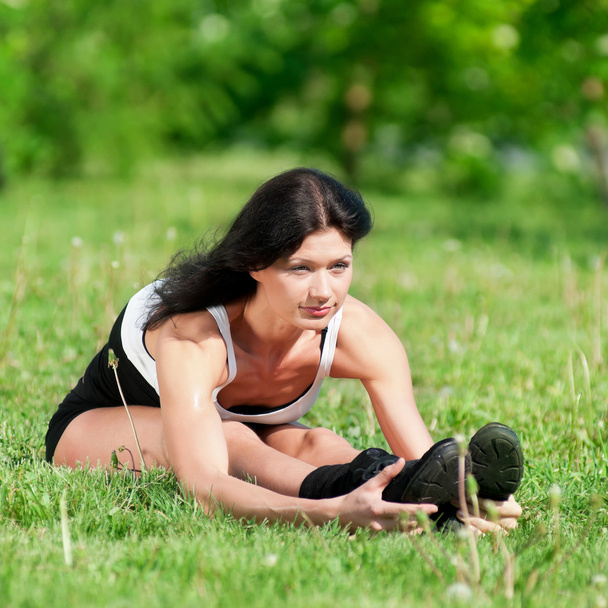 Woman doing stretching exercise. Yoga - Фото, изображение