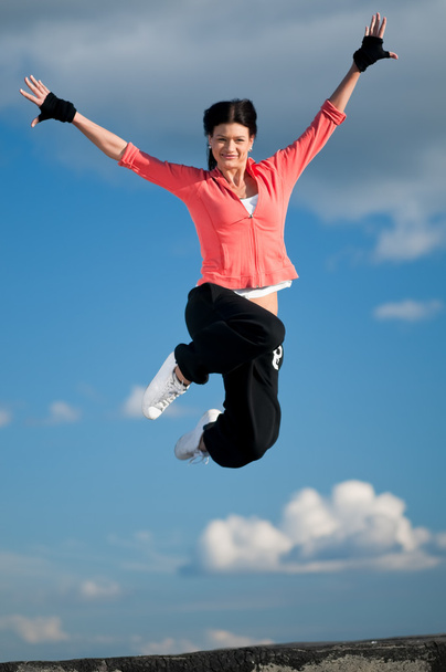 Sport woman jumping and fly over sky - Fotoğraf, Görsel
