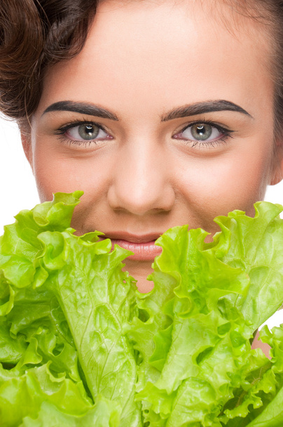 Closeup portrait of emotional beauty woman with green lettuce - Фото, зображення