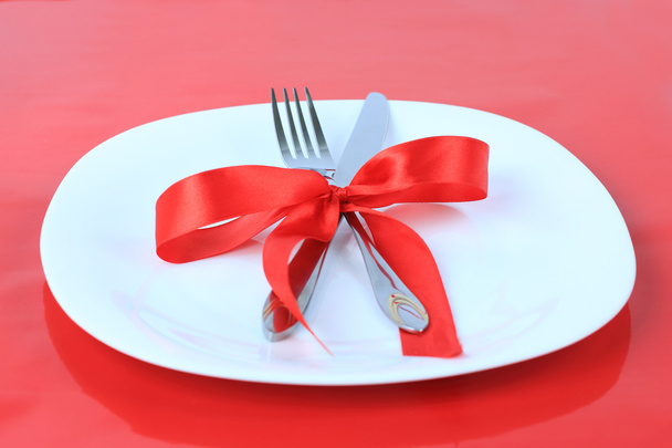 Romantic Dinner on red background. Place setting for Valentine's - Фото, зображення