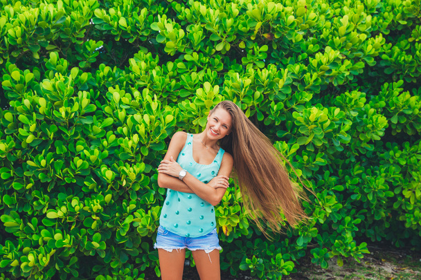 girl on green leaves background - Fotografie, Obrázek