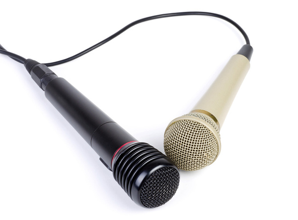 Két mikrofon egy kötéllel, elszigetelt fehér background. - Fotó, kép