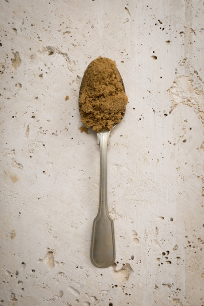 Teaspoon with light brown sugar - Photo, Image