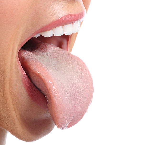Close up of a woman mouth sticking tongue - Foto, Bild