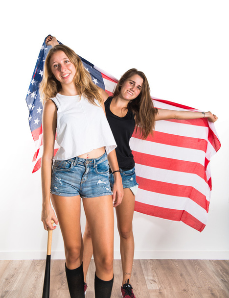 Friends holding an american flag - Photo, Image