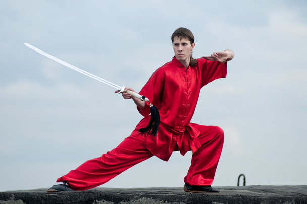 Wushoo man in red practice martial art - Photo, Image