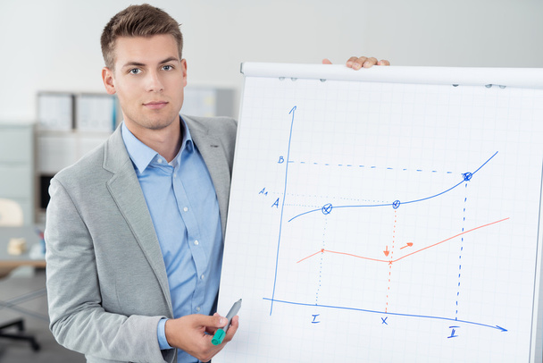 Young Businessman Showing a Graph on Poster - Photo, Image