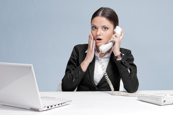 Casual business woman in office talking by phone - Photo, image