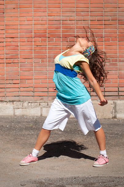 Beautiful teenage girl dancing hip-hop - Fotó, kép