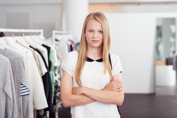 Confident Young Woman Inside Clothing Store - 写真・画像