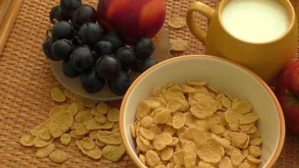 Corn flakes and milk falling in a bowl - Footage, Video
