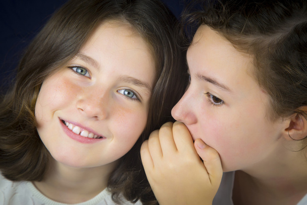 Two teenage girls telling secret - Photo, Image