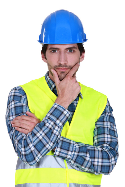 Tradesman staring intently at the camera - Фото, изображение