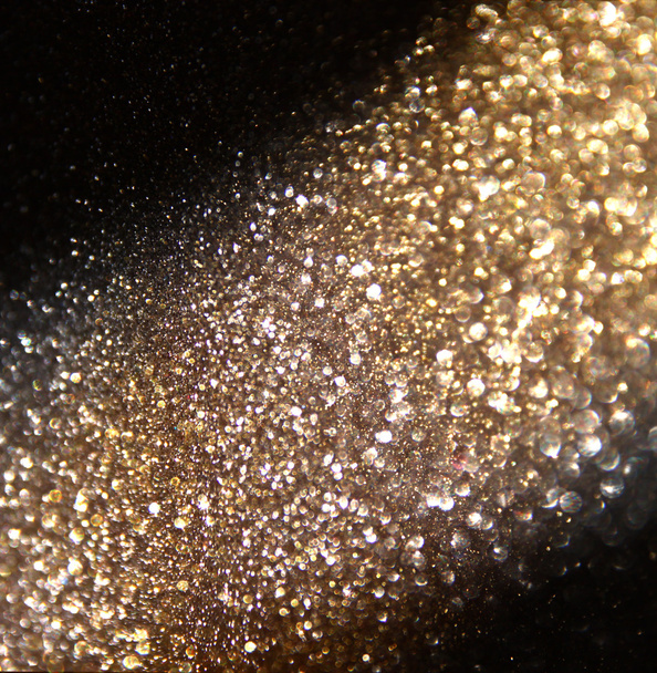 glitter vintage lights background. gold, silver, and black. de-focused - Photo, Image