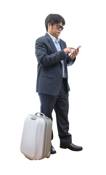 бизнесмен с помощью телефона с багажом
 - Фото, изображение