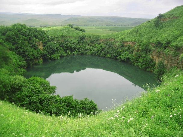 Small lake between the caucasus mountains summertime - Photo, Image