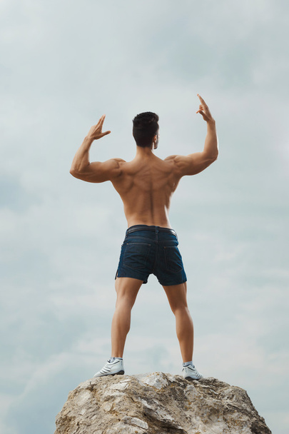 Muscular naked man from back - 写真・画像