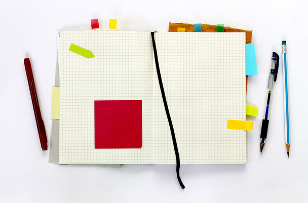 Notebook met sticky note - Foto, afbeelding