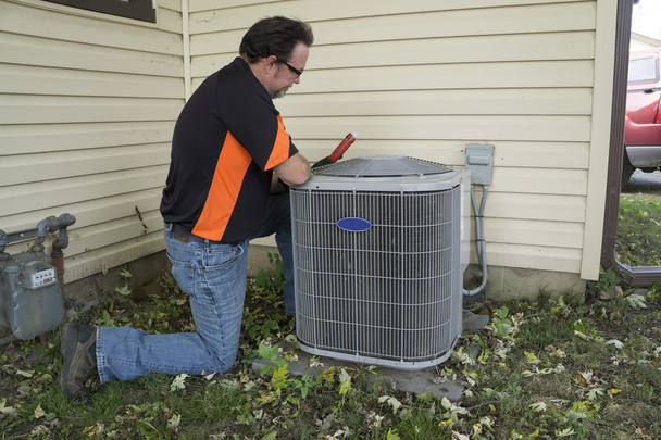 Repairman Checking Outside Air Conditioning Unit For Voltage - Photo, Image