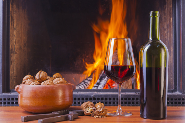 relaxing with drinks at fireplace - Photo, Image