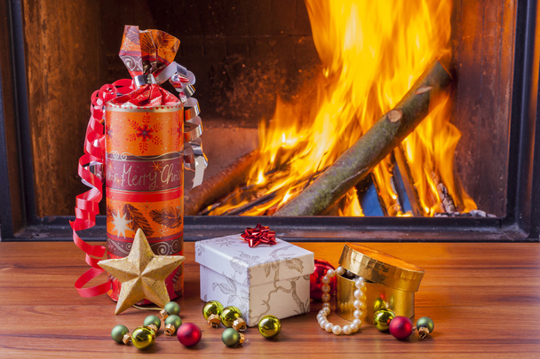 colorful christmas presents at fireplace - Фото, изображение
