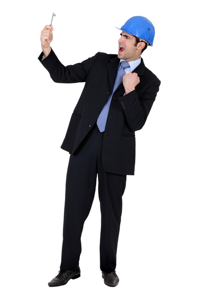 Businessman holding a key - Foto, afbeelding
