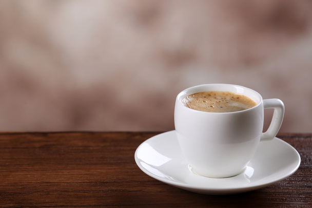 Cup of coffee on table - Φωτογραφία, εικόνα