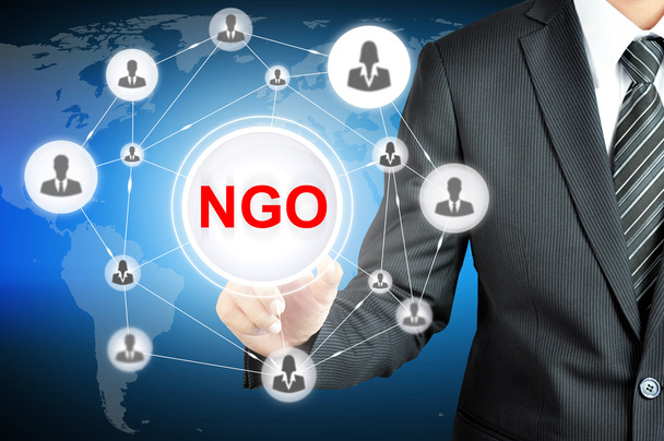 Empresário apontando em ONG (Organização Não Governamental) assinar na tela virtual
 - Foto, Imagem