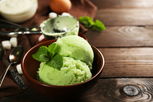 Homemade mint ice-cream on dark wooden background - Photo, image