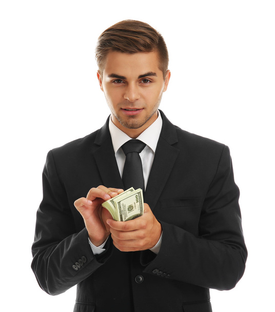 Elegant man in suit holding money isolated on white - Fotoğraf, Görsel