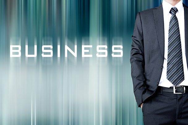 BUSINESS sign on motion blur abstract background with  standing businessman - Photo, image