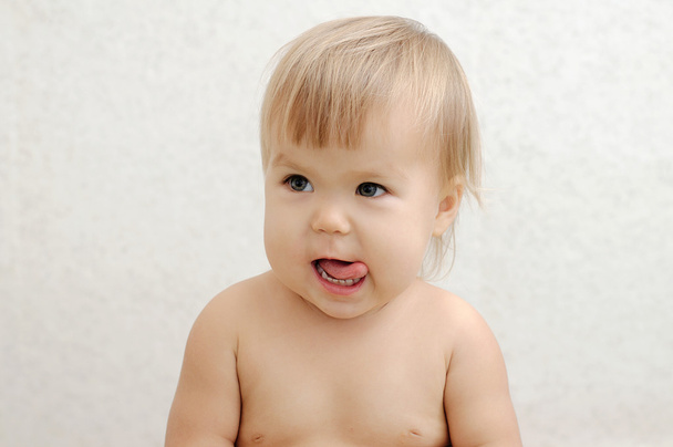 Cheerful baby sticking tongue - Foto, Imagen