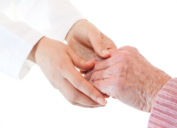 Docteur tenant la main d'une dame âgée
 - Photo, image