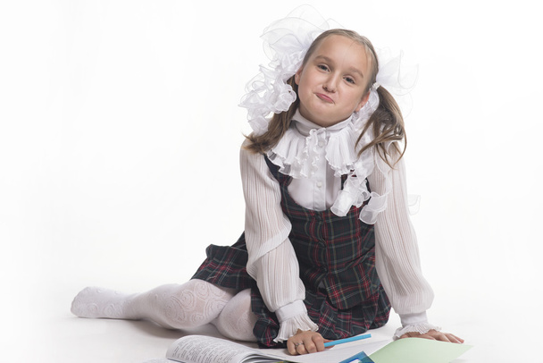 Schoolgirl with white bows - Φωτογραφία, εικόνα