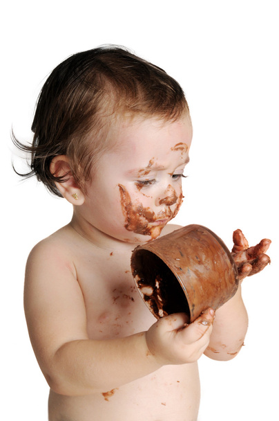 Bebé disfrutando el momento, comiendo chocolate
 - Foto, Imagen