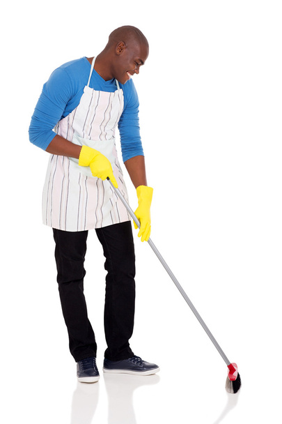 african american man sweeping - Zdjęcie, obraz