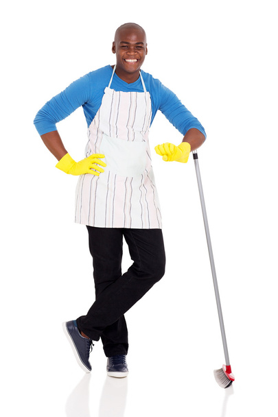 man standing with broom - Фото, изображение