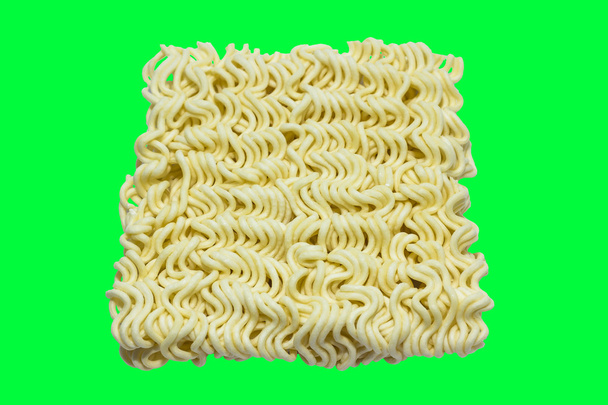 A block of uncooked Ramen Noodles Isolated on green screen chrom - Photo, Image