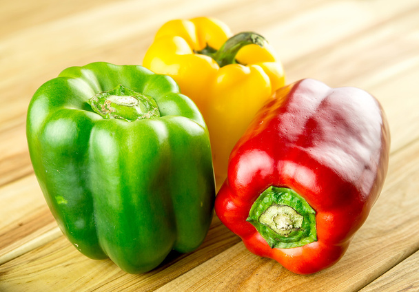 Variety of bell peppers on chopping board - Photo, Image