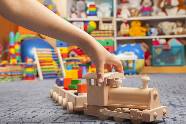 wooden train in the play room - Foto, afbeelding