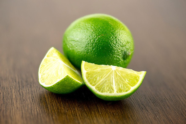 Vibrant limes on bar counter for shots - Photo, Image