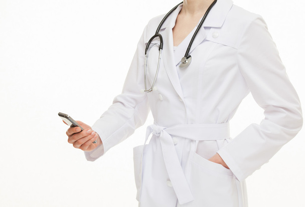 Doctor holding a mobile phone - Foto, afbeelding